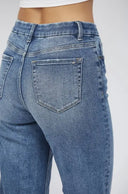 Close-up of blue jeans on a white background