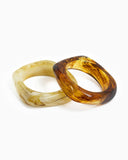 Two marble bangles in ivory and brown.