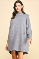 Gray mock neck mini sweater dress with front pockets.