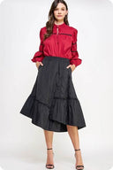 Black quilted skirt with an elastic waist and asymmetrical hem line.