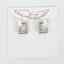 Pair of silver square earrings on a 'Virtue' branded card.