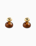 Pair of amber glass earrings with gold oval tops.