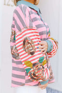 Person wearing a pink and gray striped shirt with a boho floral design.