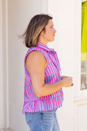 The Capri Stripe Peplum Top Entro