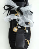 Satin shoe lace with charms. 