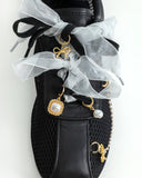 Satin shoe lace with charms. 